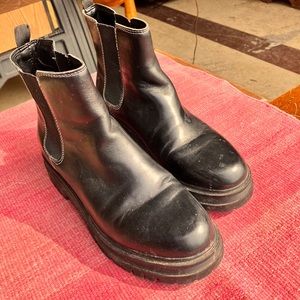 Black Chelsea boots with lug sole